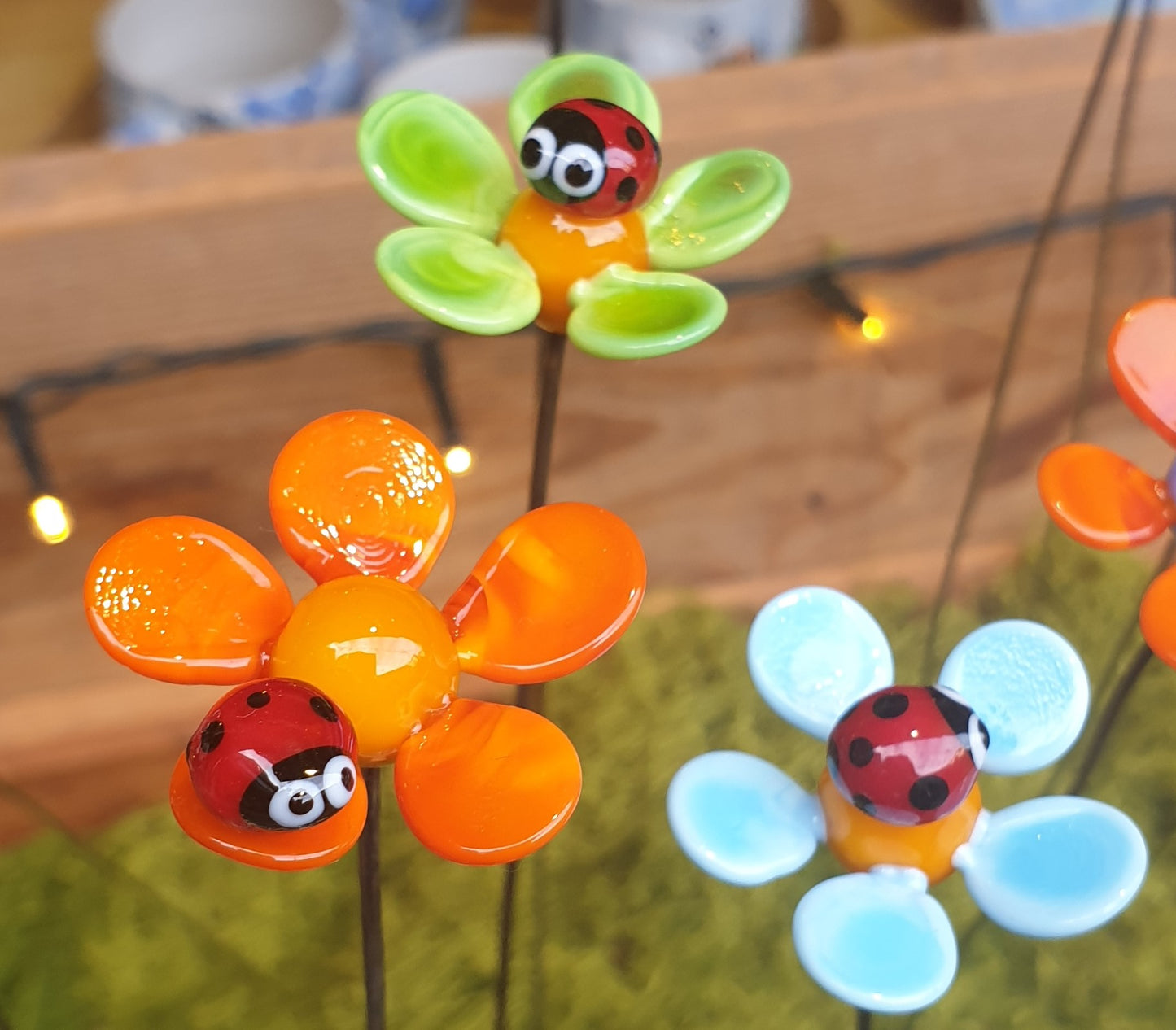 Coccinelle sur fleur en verre filé